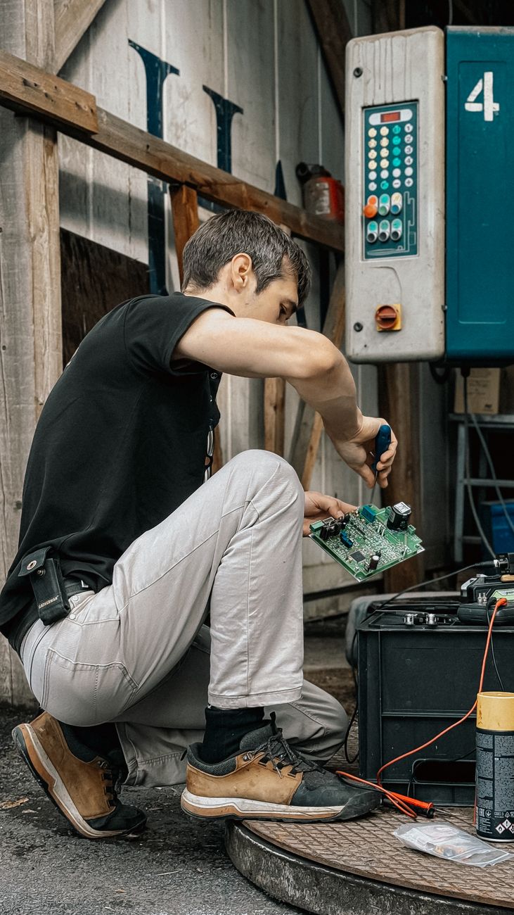 technician repairing equipment outdoors