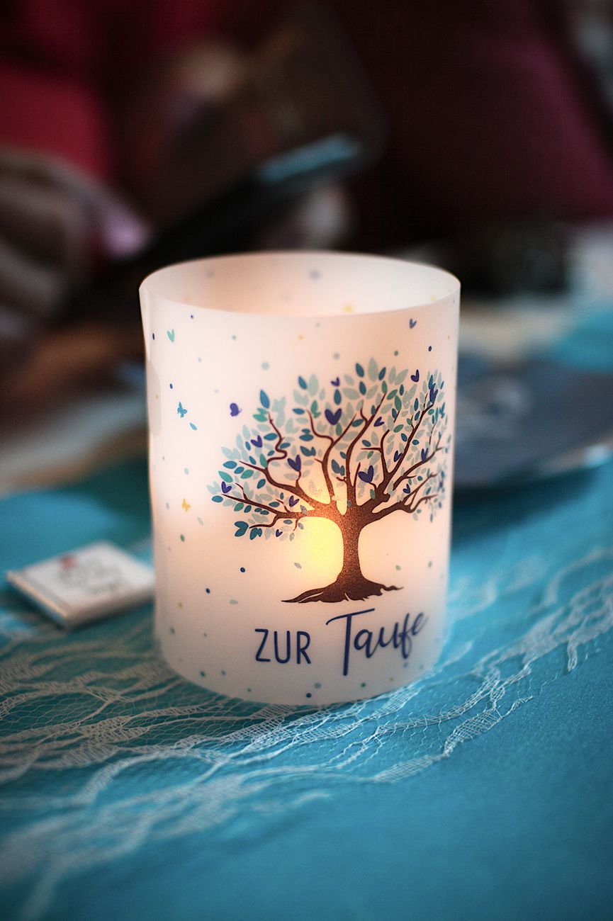 elegant candle with tree design for baptism ceremony