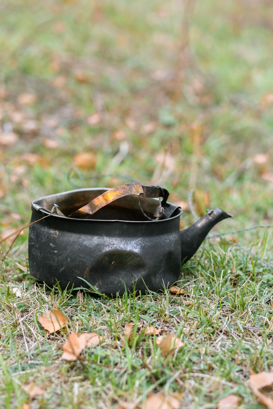 old kettle on grass in kyrgyzstan autumn scene