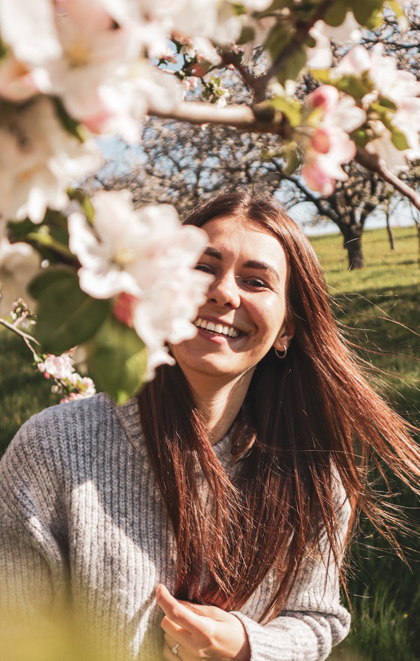 woman in gray knit sweater smiling