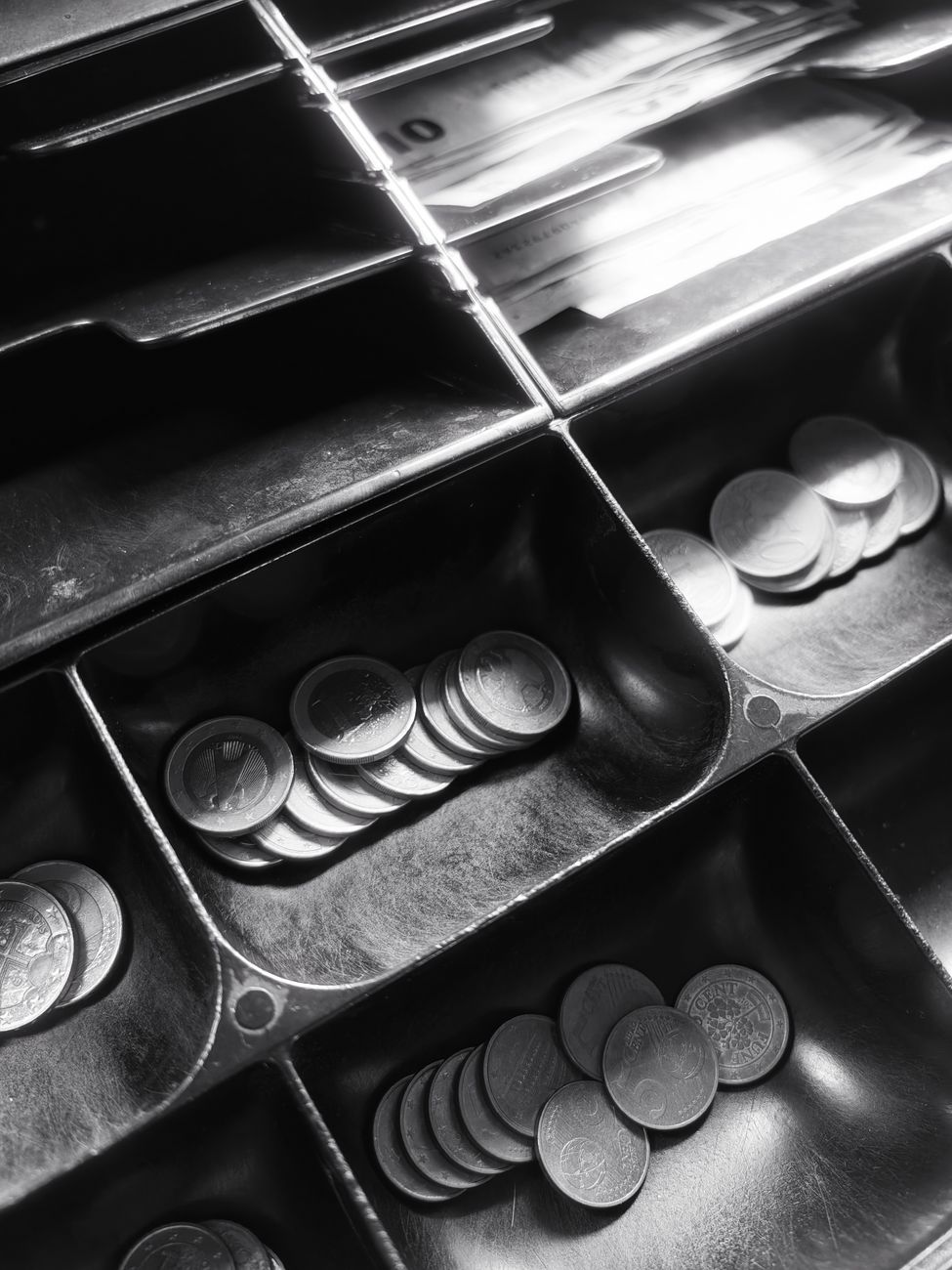 classic cash register drawer with coins and bills
