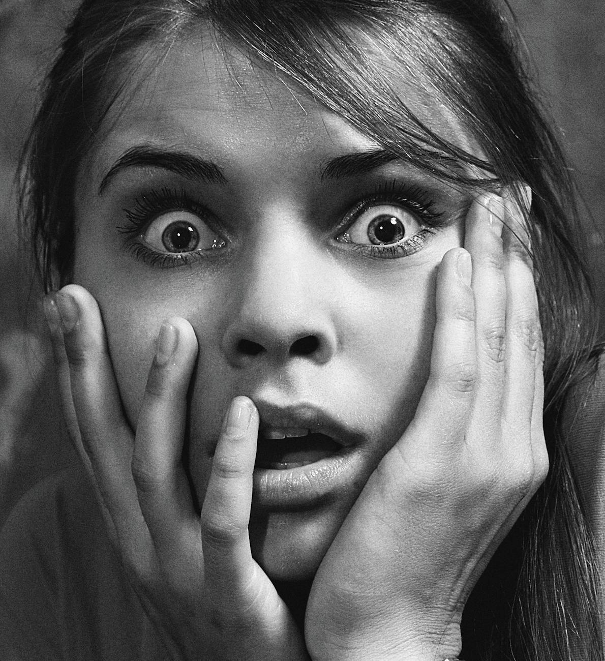 close up photo of a shocked woman