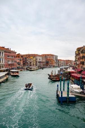 boat on water near buildings during daytime