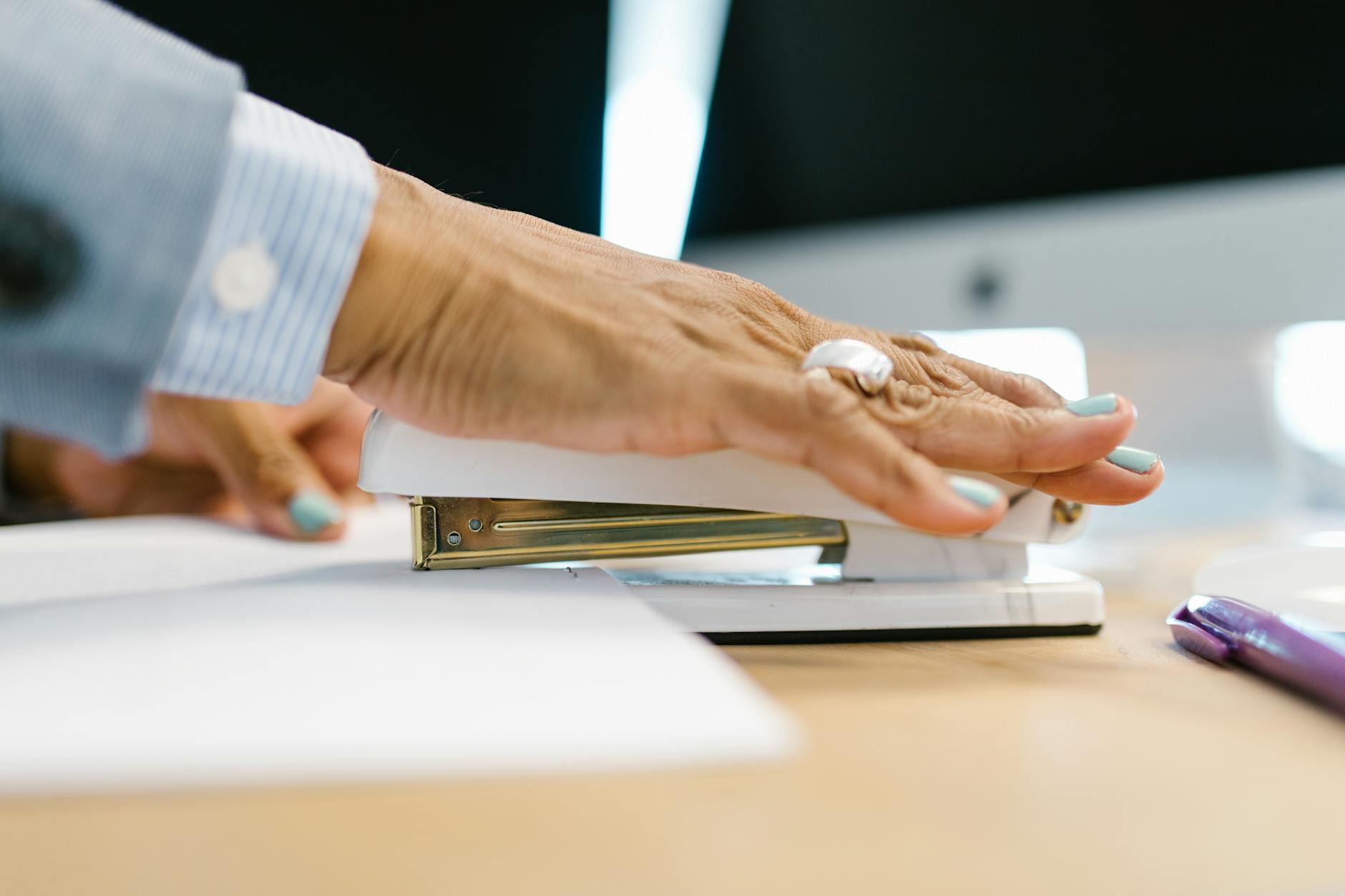 person using the stapler