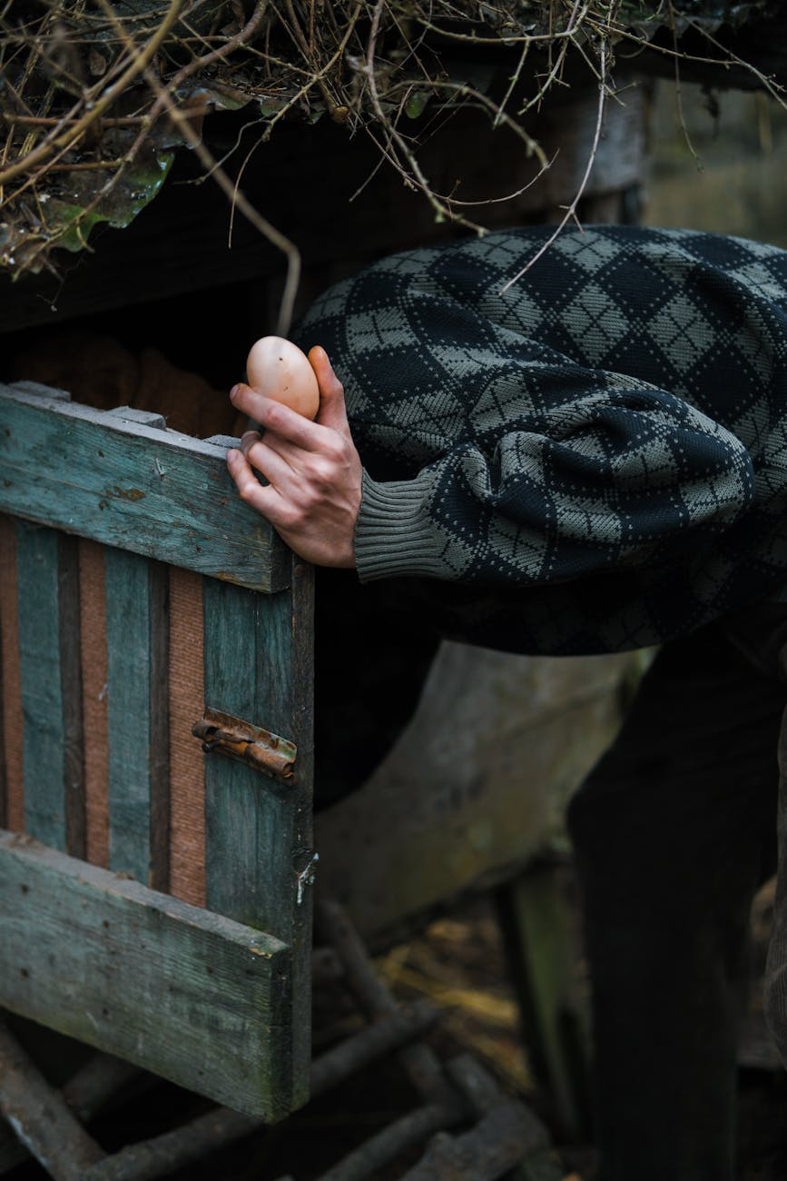man holding egg